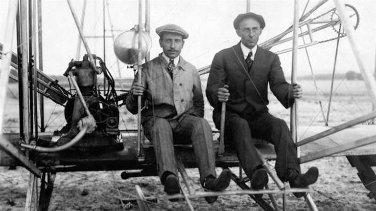 The Wright brothers preparing to take off (www.biography.com ())
