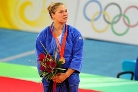Ronda with her Olympic bronze medal (truemerchant.com ())