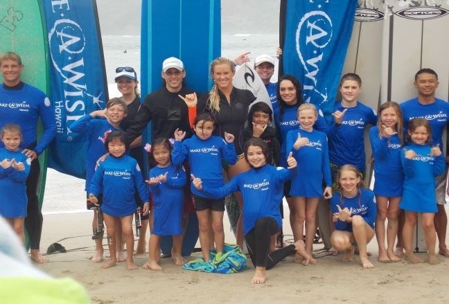Bethany teaching little kids how to surf (hawaii.wish.org (make a wish foundation))