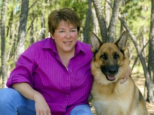 Theresa Strader and a dog she saved. (Google images ())