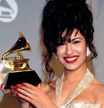 Selena holding Grammy at 36th annual celebration (Image Address: http://www.latinlife.com/media/tinymce-images/SelenaGrammy_5E3ItCs.jpg)