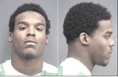 Cam Newton mugshot    (http://deadspin.com/5713743/yes-cam-newton-wrote-h (Deadspin))