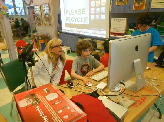 Media Arts Director Wendy Milette assists students during the ECO-Heroism program at the Laguna Beach Boys and Girls Club