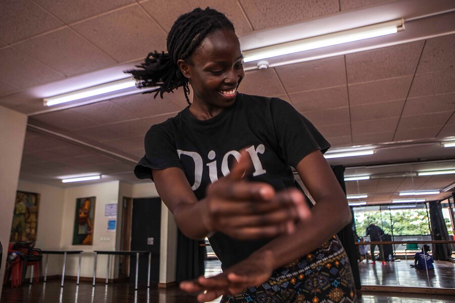 Picture of Kenyan troupe moves to a jubilant beat, welcoming dancers with disabilities