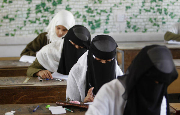Girls take the final examination of their primary school in Sanaa June 25, 2013. The final examination is held during the 9th grade of primary education in Yemen.	<P>(Khaled Abdullah/Reuters)