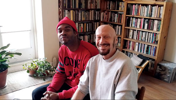 Jovan Hansman (l.) and his adoptive father, Bob Hansman, enjoy time together at Bob’s apartment in downtown St. Louis. As Bob's City Faces children's arts program celebrates its 20th anniversary, it also has a new director: Jovan Hansman.  <P>Marjorie Kehe/The Christian Science Monitor