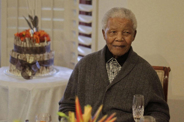 Former South African president Nelson Mandela in a file photo from July 2012. He has been hospitalized.  <P>AP/File