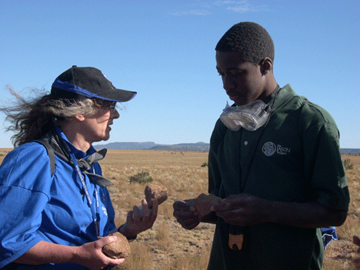 <h5>Dr. Pamela Clark, geoscientist for NASA Goddard Space Flight Center and Student Argonaut Chris Scarver examine shocked sandstone at Meteor Crater in Arizona as part of the JASON Expedition: Mysteries of Earth and Mars </h5><P>