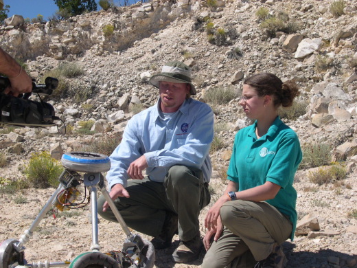 <h5> As an alternative to a wheeled rover, Dr. Allan Treiman, Planetary Geologist from the Lunar and Planetary Institute, TX, and student Argonaut Anna go over the operation of the TET prototype at Meteor Crater in Arizona as part of the JASON Expedition: Mysteries of Earth and Mars. It's a tetrahedral walker that tumbles to negotiate the rough landscape. Made up of six struts, it can be independently retracted or expanded telescopically, like the legs of a camera tripod. It moves by either shrinking or extending its edges to move its center of gravity beyond its base, so that it falls over. </h5><P>