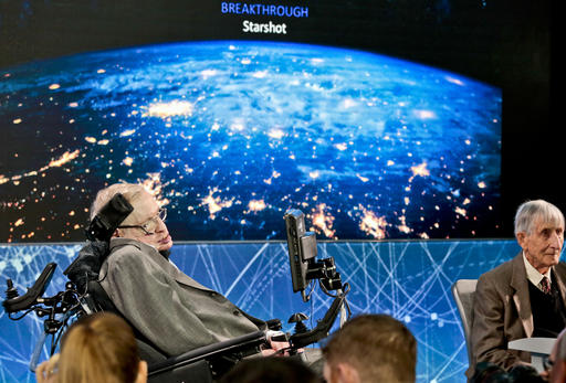 Cosmologist Stephen Hawking, left, joined by a group of of scientist including Princeton physicist Freeman Dyson, right, announce the new Breakthrough Initiative focusing on space exploration and the search for life in the universe, during a press conference, Tuesday, April 12, 2016, at One World Observatory in New York. The $100 million project is aimed at establishing the feasibility of sending a swarm of tiny spacecraft, each weighing far less than an ounce, to the Alpha Centauri star system. (AP Photo/Bebeto Matthews)