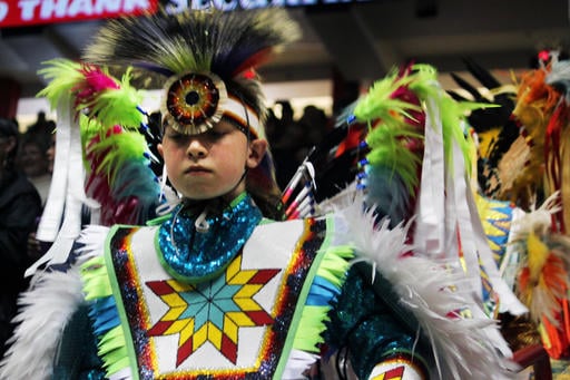 Nearly 3,000 indigenous dancers from across the United States and other countries participate in the first grand entry of the 33rd annual Gathering of Nations in Albuquerque, N.M., on Friday, April 29, 2016. (AP Photo/Susan Montoya Bryan)