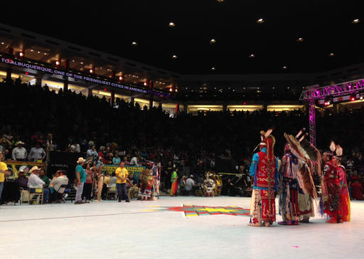 The four head dancers selected to lead the 33rd annual Gathering of Nations are recognized following the event's grand entry in Albuquerque, N.M., on Friday, April 29, 2016. (AP Photo/Susan Montoya Bryan)