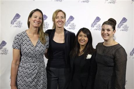 In this April 8, 2016 photo, the Associated Press team that investigated seafood caught by slaves poses, from left, Martha Mendoza, Robin McDowell, Esther Htusan and Margie Mason, at the George Polk Award luncheon in New York. The team won the Pulitzer Prize for public service announced Monday, April 18, 2016. (AP Photo/Richard Drew)