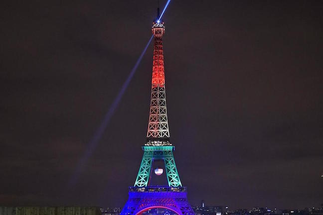 The Eiffel Tower in Paris, France, shines on Monday in the colors of a rainbow to honor victims of Sunday's mass shooting at an Orlando gay club. Martin Meissner/AP