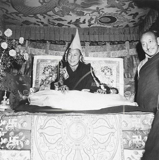 November 9, 1950 - The Dalai Lama, 15-year-old ruler of Tibet , smiles from his Throne in Lhasa, Capital City of the Mountainous Asiatic country, November 9, 1950. He wears a gold peaked cap that is his Crown. A report from New Delhi, India. Nov 9. Indicated that the young ruler still was in Lhasa and that his cabinet and the national Assembly were in continuous session. This picture one of the most recent of the Dalai Lama, Was Made by Lowell Thomas , Jr. For Use in his forthcoming Book 