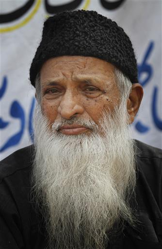 In this Monday, Aug. 2, 2010 file photo, Pakistani humanitarian leader Abdul Sattar Edhi collects donations in Peshawar, Pakistan. The family of Pakistan's legendary philanthropist Abdul Sattar Edhi has asked people to pray for him after his health deteriorated further and he was said to be breathing through a ventilator. (AP Photo/Anjum Naveed, File)