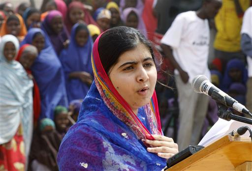 Malala Yousafza speaks to refugees in the Dadaab refugee camp, Kenya, Tuesday, July 12, 2016. Nobel laureate Malala Yousafzai is spending her 19th birthday in Kenya Tuesday visiting the world's largest refugee camp to draw attention to the global refugee crisis, especially as Dadaab camp faces pressure to close after a quarter-century. (AP Photo/Khalil Senosi)