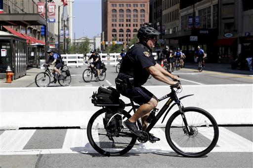 Law enforcement on bikes patrol downtown Cleveland, Tuesday, July 19, 2016, during the second day of the Republican convention. (AP Photo/Patrick Semansky)