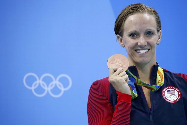 Dana Vollmer (USA) poses with her bronze medal for the 100m butterfly at the 2016 Rio Olympics. She qualified for the Rio Games after retiring in 2013 and having her first child in 2015. Photo: David Gray/Reuters