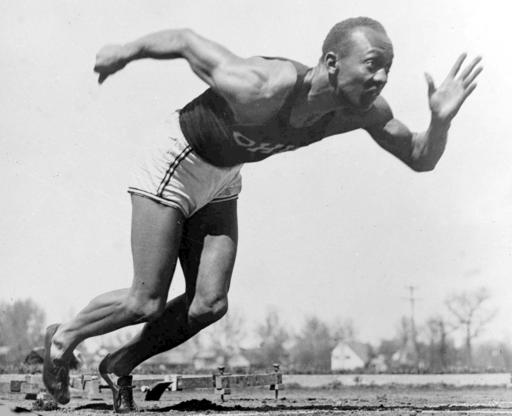 File - In this Aug. 5, 1936 file photo, American athlete Jesse Owens practices in the Olympic Village in Berlin. Shortly after Jesse Owens returned home from his snubbing by Adolph Hitler at the 1936 Olympics, he and America's 17 other black Olympians found a less-than-welcoming reception from their own government, as well. On Thursday, Sept. 29, 2016 relatives of those 1936 African-American Olympians will be welcomed to the White House and will get to shake the President's hand, an honor Owens and the others didnâ??t receive after they returned home from Berlin 80 years ago. (AP Photo/File)