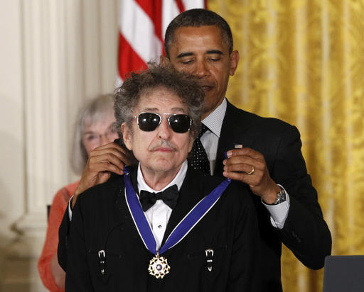 In this May 29, 2012, file photo, President Barack Obama presents rock legend Bob Dylan with a Medal of Freedom during a ceremony at the White House in Washington. Dylan won the 2016 Nobel Prize in literature, announced Thursday, Oct. 13, 2016. (AP Photo/Charles Dharapak, File)