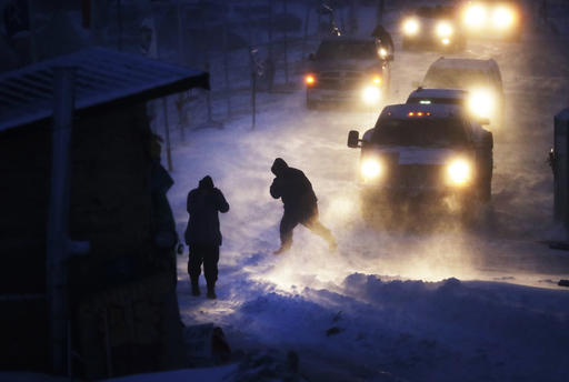 Cars line up at an exit ramp covered in snow at the Oceti Sakowin camp where people have gathered to protest the Dakota Access oil pipeline in Cannon Ball, N.D., Tuesday, Dec. 6, 2016. Many Dakota Access oil pipeline opponents who've gathered for months in the camp are committed to staying despite wintry weather and demands that they leave. An overnight storm brought several inches of snow, winds gusting to 50 mph and temperatures that felt as cold as 10 degrees below zero. (AP Photo/David Goldman)