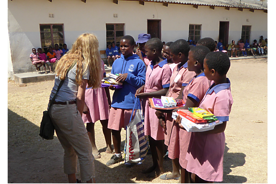 Julie Phippen, founder of Sewpportive Friends, visited rural village schools in Zimbabwe last summer to deliver kits that she and others had made. (Courtesy of Sewpportive Friends)