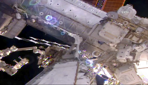 This still image taken from live video provided by NASA shows astronaut Shane Kimbrough, right, works on the International Space Station during a space walk on Friday, March 24, 2017. Kimbrough and France's Thomas Pesquet emerged early from the orbiting complex, then went their separate ways to accomplish as much as possible 250 miles up. Their main job involves disconnecting an old docking port. This port needs to be moved in order to make room for a docking device compatible with future commercial crew capsules. (NASA via AP)