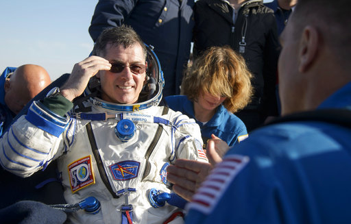NASA astronaut Shane Kimbrough rests in a chair outside the Soyuz MS-02 spacecraft just minutes after he, Russian cosmonaut Sergey Ryzhikov of Roscosmos, and Russian cosmonaut Andrey Borisenko of Roscosmos landed near Dzhezkazgan, Kazakhstan on Monday, April 10, 2017. Kimbrough, Ryzhikov, and Borisenko returned from the International Space Station. (Bill Ingalls/NASA via AP)