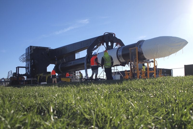 In this May 19, 2017 photo supplied by Rocket Lab, engineers work with the Electron rocket at the launch site on the Mahia Peninsula in the North Island of New Zealand. New Zealand has never had a space program but could soon be launching commercial rockets more often than the United States. That’s if the plans of California-based company Rocket Lab work out. Founded by New Zealander Peter Beck, the company was last week given approval by the Federal Aviation Authority to conduct three test launches from a remote peninsula and the first could come as early as Monday. (Rocket Lab via AP)