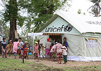 Children play outside of a UNICEF supplied tent (UNICEF)