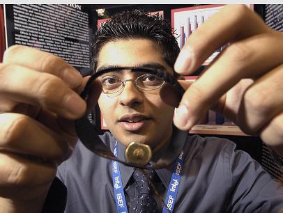 Ameen Abdulrasool showing his winning invention. (Intel.com)