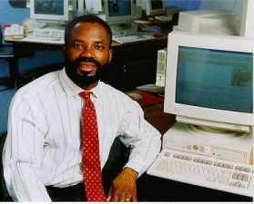<a href=http://z.about.com/d/inventors/1/0/h/7/emeagwali_white_shirt_june_1996.jpg>Philip Emeagwali</a>
