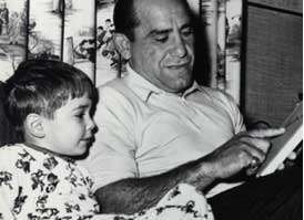 Yogi reads to one of his three sons. (Courtesy of the Yogi Berra Museum and Learning Center)