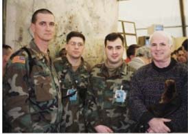 McCain standing with a group of U.S. Soldiers