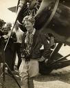 Amelia next to her one her planes.