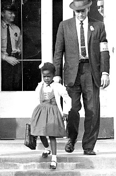 Ruby Bridges being escorted from school. (http://www2.scholastic.com/browse/article.jsp?id=3747978)