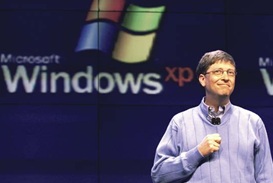 Bill Gates standing in front of the Windows logo  (http://media-2.web.britannica.com/eb-media/71/103171-004-9425CEF8.jpg)