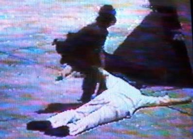 This is a picture of Benigno after he was shot on (http://2.bp.blogspot.com/_JfNKHb9OV6U/Sa--gIZoGpI/AAAAAAAAAJA/Zl24yxmspAw/s400/Ninoy_on_the_tarmac.JPG)