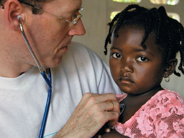 Dr. Farmer cares for a young girl (http://www.bc.edu/bc_org/rvp/pubaf/chronicle/v13/a28/farmer.jpg)