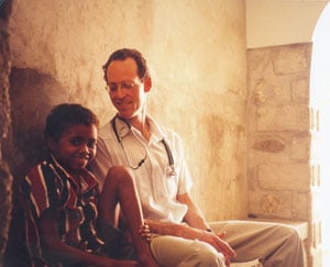 Dr. Farmer and a young girl (http://www.washington.edu/alumni/columns/sept06/images/stories/sep06_columns/word.jpg)