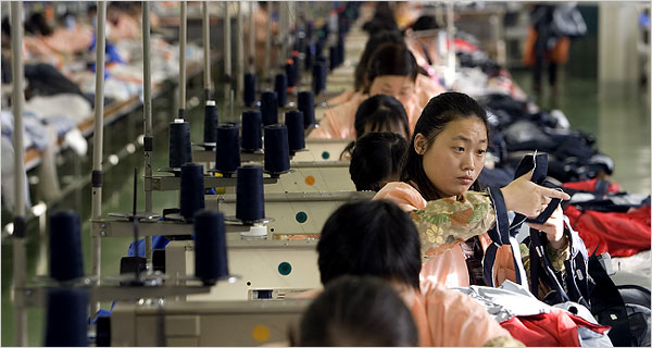 Chinese workers in a clothing factory. (http://chinadigitaltimes.net/2007/04/romania-a-poor-land-imports-poorer-workers-matthew-brunwasser/)