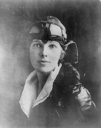 Amelia Earhart with googles and leather hat. (http://www.biography.com/people/amelia-earhart-9283280/photos (1996?2012 A+E Television Networks, LLC.))
