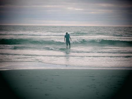 Carson wading in the ocean. (Source: https://sites.google.com/a/rcschool.org/mr (Carson Blair))