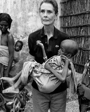 Audrey is a holding a young, weak, starving, child (www.audreyhepburn.com ())