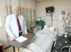Dr. Dudrick working (http://citizensvoice.com/news/charitable-doctor-will-teach-at-misericordia-1.1349933)