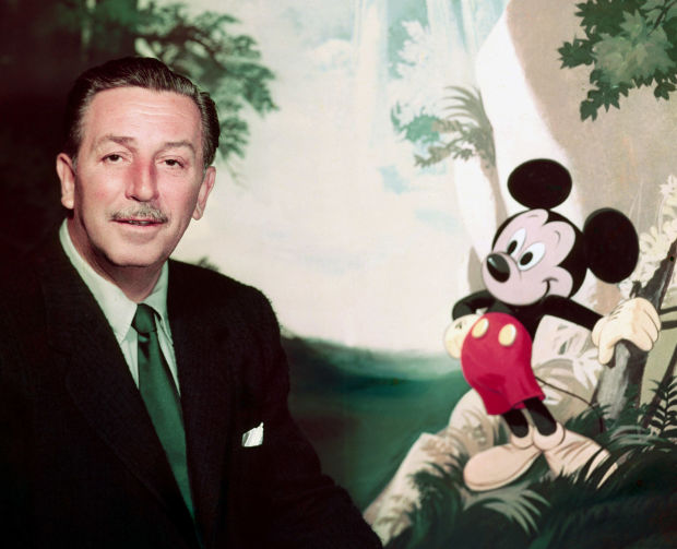 He's all smiles with Mickey Mouse. (https://www.google.com/search?q=walt+disney&espv=2 ())