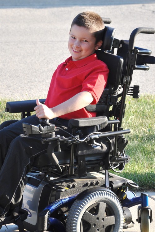 Jack Mcgraw smiling in his wheelchair (http://qctimes.com/jack-mcgraw/image_95db9a7c-1e0c (Unknown))