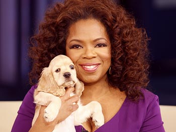 Oprah with a puppy