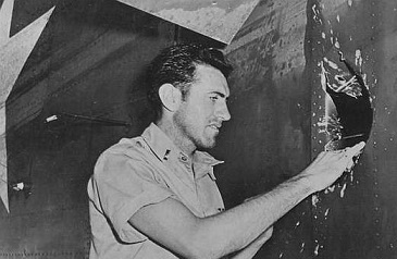 Louis evaluates a bullet hole in his plane (http://gagomilitaria.blogspot.com/2014/12/luis-zam ())